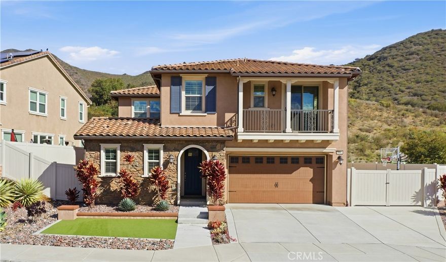Premier luxury home in the highly sought-after Horse Creek Ridge community, offering a spacious 3,844 sq ft floor plan with PAID SOLAR, 5 bedrooms (4 with ensuite baths), and stunning indoor–outdoor living. This upgraded residence features a gourmet chef’s kitchen, a large upstairs loft, and a private entertainer’s backyard—checking every box buyers look for: move-in ready, turn-key, spacious, private, and beautifully upgraded.

Step inside to a bright, open-concept layout filled with natural light and designer finishes. The chef’s kitchen boasts GE and Café appliances, quartz countertops, custom cabinetry, a walk-in pantry and butler’s pantry, and a stylish backsplash—perfect for entertaining or hosting holidays. The family room includes a cozy fireplace and flows seamlessly into the oversized dining area, creating the ideal great room for modern living. Luxury vinyl plank flooring, plantation shutters, and thoughtful upgrades add elegance throughout the main floor.

Upstairs, a spacious loft provides the perfect bonus room for a home theater, game room, or second living space. All five bedrooms are generously sized, with four featuring private ensuite bathrooms, offering comfort and convenience for family, guests, or multi-generational living.

Outside, enjoy a low-maintenance, drought-tolerant yard with a custom putting green, private courtyard, and plenty of space for entertaining. This home also includes a fully paid 5kW solar system, a two-car garage with tandem area, expanded gated parking, and a rare three-car driveway—ideal for extra vehicles, RV, or toys.

Living in Horse Creek Ridge means resort-style amenities: 7 private parks, clubhouse, pool, spa, and scenic hiking trails including the Monserrat Mountain Trailhead. With quick I-15 access, you're minutes from Fallbrook, Bonsall, Temecula, and all major conveniences.