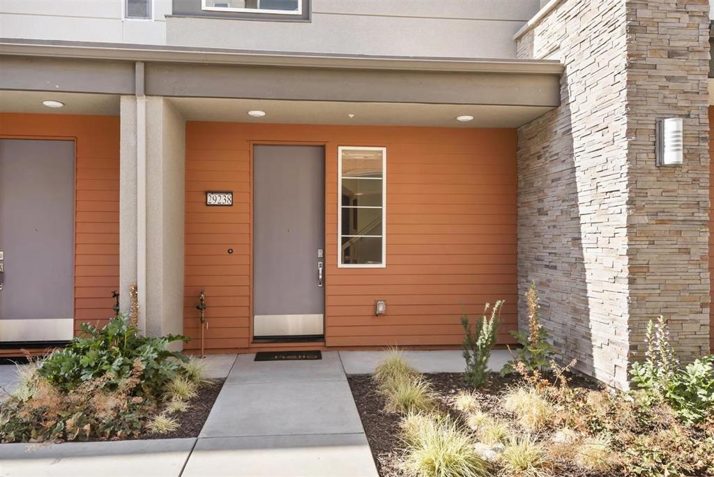 Located in the reputable SOHAY community, this recently built MOVE IN READY, open floor plan contemporary unit, has a lot to offer: tons of natural light with 12 double pane windows, a balcony, a large double door closet in the entry hall, stylish interior design with painted accent walls, custom blinds, a large stainless steel kitchen sink with a sleek and seamless look perfectly integrated into the large kitchen island, stainless steel energy-efficient appliances, gas cooktop and stove for cooking purists, master bath with double sinks and a huge glass-enclosed shower with spa-like built-in seat, a walk-in closet in the bedroom, solar energy to save you money on your electrical bill, ceiling fans, AC, attached garage, driveway, and more. ALL THESE UPGRADES ARE ALREADY INCLUDED IN THE PRICE. Great location in the community, walking distance to the SOUTH HAYWARD BART station for commuters, easy access to 880 and 238, 10 minutes drive to downtown Hayward. This unit can be rented!