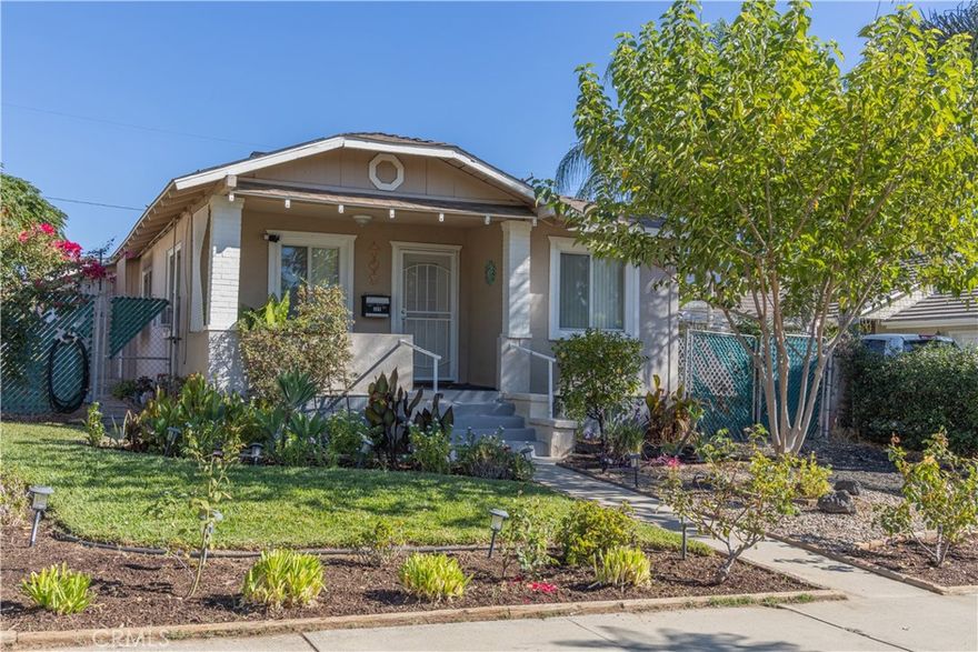 This home is located in the heart of historical downtown Lake Elsinore, upgraded, and a historical property! This home was built in 1921! The house has 3 bedrooms, 2 bathroom, and is 1,233 sqft (approx), with lush landscaping in the front yard and a secluded back yard with enough room for large gatherings, pets, and toys. There is a alleyway that allows for rear access to the back yard, which has a gate to allow parking for RV's, boats, and offroad vehicles. Inside the home, you will find tile floors and countertops in the kitchen, and wood and tile flooring in the bathrooms. The home makes good use of its more open floor plan and has a fireplace with a built-in bookshelf. The back yard includes a shed and is landscaped and the home also has leased solar panels, which the lease can be transferred. This home is close to schools, churches, shopping, dining, Storm Stadium, and the I-15 for quick and easy commuting. The property is also within walking distance to the lake and Elm Grove Beach, which has volleyball courts, bathrooms, access to fishing, and swimming. This quaint, little historical home is a great property and also an opportunity to own a bit of history! Schedule your showing today!