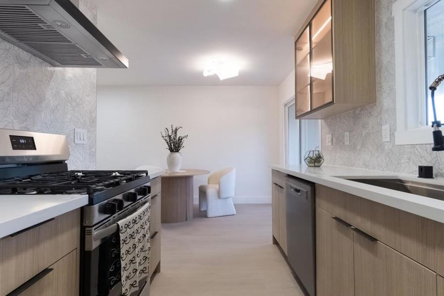 Discover this stunning, fully renovated 2-bedroom, 1-bath home offering 910 sq. ft. of modern luxury and comfort. Step into a bright, open living room filled with natural light, leading to a gorgeous galley kitchen with brand-new appliances, new heating, new cabinets, and quartz countertops  perfect for everyday living and entertaining. The spa-inspired bathroom features porcelain tile, LED mirrors, and a new vanity. Enjoy premium upgrades throughout, including Level 5 smooth walls, dual-pane windows, luxury flooring, recessed lighting, and fresh interior paint. Conveniently located near top shopping, dining, and major attractions, this home offers the perfect blend of style, comfort, and convenience. Move-in ready and absolutely beautiful.  A must-see house !