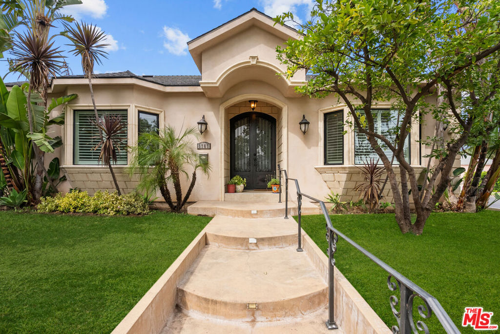 Exquisite Contemporary Mediterranean in Encino Village. Rebuilt in 2013, this warm Mediterranean single-story home with contemporary elements showcases exceptional craftsmanship and design. A dramatic iron double-door entry with laminated glass opens to soaring 10-foot ceilings and light-filled living spaces. The formal living and dining areas are accented by a picture-perfect bay window and elegant polished porcelain floors that extend throughout the main rooms. The spacious chef's kitchen is a true centerpiece, featuring custom antique white glazed cabinetry, Caesarstone countertops, stainless steel appliances, and a striking maple espresso center island with pendant lighting. This residence offers a sleeping wing with 4 bedrooms and 2.5 baths, including a romantic primary suite with a walk-in closet and spa-inspired bath complete with jet soaking tub, glass-enclosed shower, dual vanities, and porcelain floors enhanced by Venetian plaster finishes. Designer details abound, including custom paint, Venetian plaster walls in the baths, 7" crown moldings, recessed lighting, engineered wood flooring and precast concrete trim framing the entry and windows. A rare find in prime Encino, the property also includes a two-car garage; a feature seldom found in this neighborhood, with entry to the backyard, a rear covered patio provides shade and comfort, overlooking a grassy backyard framed by colorful landscaping, perfect for entertaining or relaxing in a private, serene setting. Ideally located near parks, golf courses, top rated schools, Encino Sports Center, Ventura Boulevard's restaurants and vibrant shops, Trader Joe's, and easy access to the 101 and 405 freeways. Blending timeless Mediterranean warmth with sleek contemporary touches, this home is an elegant retreat.