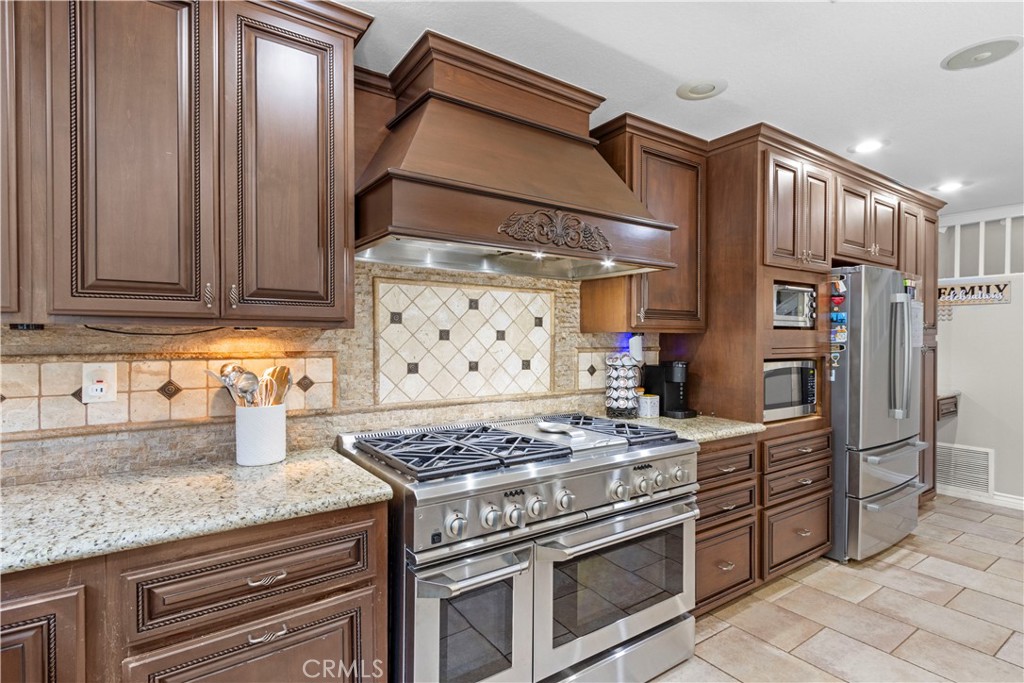 Welcome to this beautifully upgraded home in the highly desirable Butterfield Ranch community of Chino Hills!
This 3-bedroom, 2.5-bath home features a bright, open floor plan with fresh interior and exterior paint, porcelain tile flooring downstairs, and a cozy wood-burning fireplace with gas hookup. The remodeled gourmet kitchen boasts granite countertops, custom cabinetry, travertine backsplash, a massive 48” 6-burner professional range with griddle, large center island with built-in beverage fridge, and newer dishwasher and disposal.
Upstairs includes engineered wood flooring throughout, a spacious loft/bonus room perfect for an office or second living area, and updated bathrooms—including a hall bath with dual sinks. All bedrooms feature ceiling fans, and the home is equipped with fiber optic internet, a whole-house fan, and a recently serviced 4.5-ton two-stage A/C system. Step outside to your private backyard oasis with stamped concrete, built-in BBQ island, and a fire pit—ideal for entertaining. Dual-pane windows and sliding doors offer energy efficiency, and rain gutters add low-maintenance convenience.
Located just a short walk to Butterfield Ranch Elementary, nearby parks, and a city-sponsored preschool. Minutes to Los Serranos Country Club, shopping, and major freeways for easy commuting to Orange County, LA, and the Inland Empire.
Don't miss your chance to own this turnkey home in one of Chino Hills' most sought-after neighborhoods!