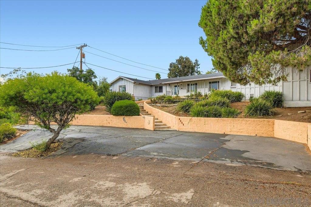 ATTN ALL INVESTORS! Looking for your next project? This amazing property is ready for your vision and creativity! At nearly 3,000 square feet, this home has 4-bedrooms and 4-1/2 baths (3 ensuite) and both expansive living and family rooms, as well as a huge kitchen. This home includes a large pool as well as amazing views! BONUS - the property has prized rose bushes cherished by the previous owner. Come see this opportunity and let's hear your ideas!