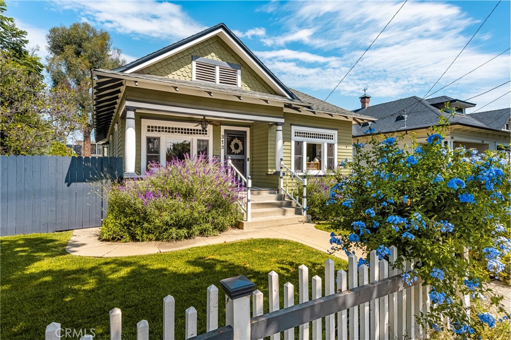 Located in the heart of the historic district of Old Towne Orange, this beautifully updated 3-bedroom, 2-bath home blends timeless charm with modern comfort. The inviting front porch sets the tone for relaxed evenings and neighborly charm, while inside you’ll find warm hardwood floors, an upgraded kitchen with stainless steel appliances, and remodeled bathrooms designed with today’s lifestyle in mind. Enjoy the convenience of indoor laundry and upgraded central AC throughout the main home. In addition, a detached ADU provides incredible flexibility — complete with its own kitchen, bathroom, and AC system, it’s perfect for guests, extended family, or rental income potential. Just moments from the Orange Plaza, restaurants, shops, and Chapman University, this home offers the perfect blend of history, community, and modern upgrades. Don’t miss the chance to own a piece of Old Towne charm with added versatility!