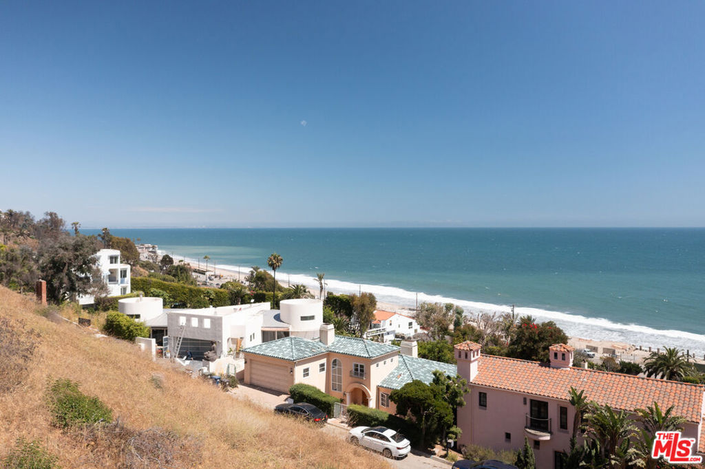 Two miles south of Surfrider Beach and the Malibu Pier, between Las Flores and Carbon canyons, the tight-knit La Costa community offers panoramic coastline views, minutes from the beach. Public beach access is only two-tenths of a mile down the street, and ownership of this parcel grants deeded access to the La Costa Beach Club. At night, the Queens Necklace sparkles, a string of coastline lights from Malibu to Palos Verdes, with Catalina beyond. This attractive parcel comes with an abundance of potential. Two geology reports point to the buildability of the site, and the up-sloping topography looks to provide panoramic 180-degree views from the upper floors of any home built here. Multi-million-dollar estates in the neighborhood reinforce the upside potential of this development opportunity.