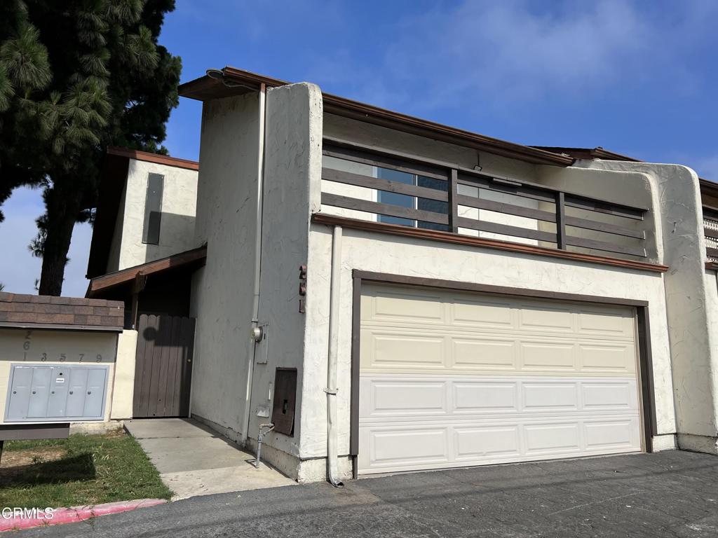 Welcome to this beautifully maintained home in the heart of Oxnard, where comfort and style come together seamlessly. Step into a bright and airy living room with soaring double-height ceilings and large windows that flood the space with natural light. The open floor plan connects the living area to a spacious dining room and a well-appointed kitchen with plenty of cabinet space--perfect for meal prep and entertaining. This home features two comfortable bedrooms, including a lovely primary suite with its own private balcony--ideal for enjoying a quiet morning coffee or unwinding at sunset. With one full bathroom and an additional half bath, the layout is both practical and inviting. Outside, a charming patio offers the perfect spot for outdoor dining or relaxing under the California sun. A private garage adds extra convenience for parking and storage. Don't miss the chance to call this Oxnard gem your own!