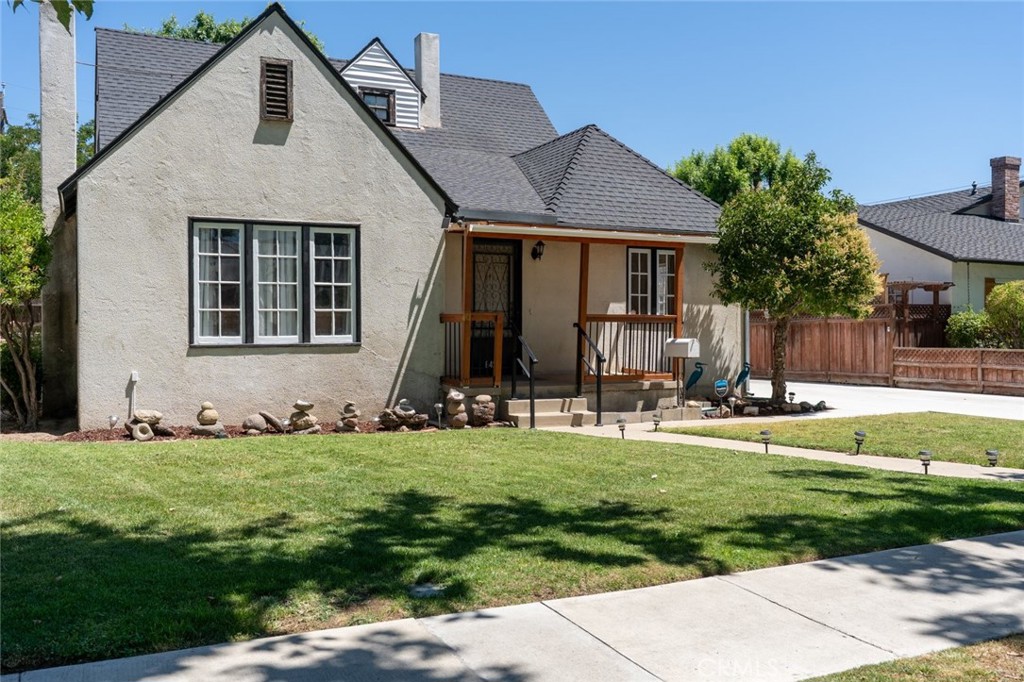 Welcome to this one-of-a-kind 4-bedroom home nestled in a beautiful, tree-lined Southside neighborhood known for its charm and great location. Featuring 2 bedrooms conveniently located downstairs, this home boasts a spacious living room with a cozy fireplace and built-in shelving, perfect for relaxing evenings. The formal dining area is filled with natural light from large windows and opens seamlessly to the rest of the home. Original hardwood floors flow throughout, adding warmth and character. The bathroom offers both a tub and separate shower stall, along with built-in shelves for added storage. Plus, partial basement. Enjoy the generous cement driveway with possible RV parking, a detached garage, and a nicely landscaped yard ideal for gatherings and outdoor fun. This truly unique home is full of charm and potential don't miss your chance to make it yours! Located right off Pacheco Blvd- close to parks, schools, restaurants and downtown Los Banos!