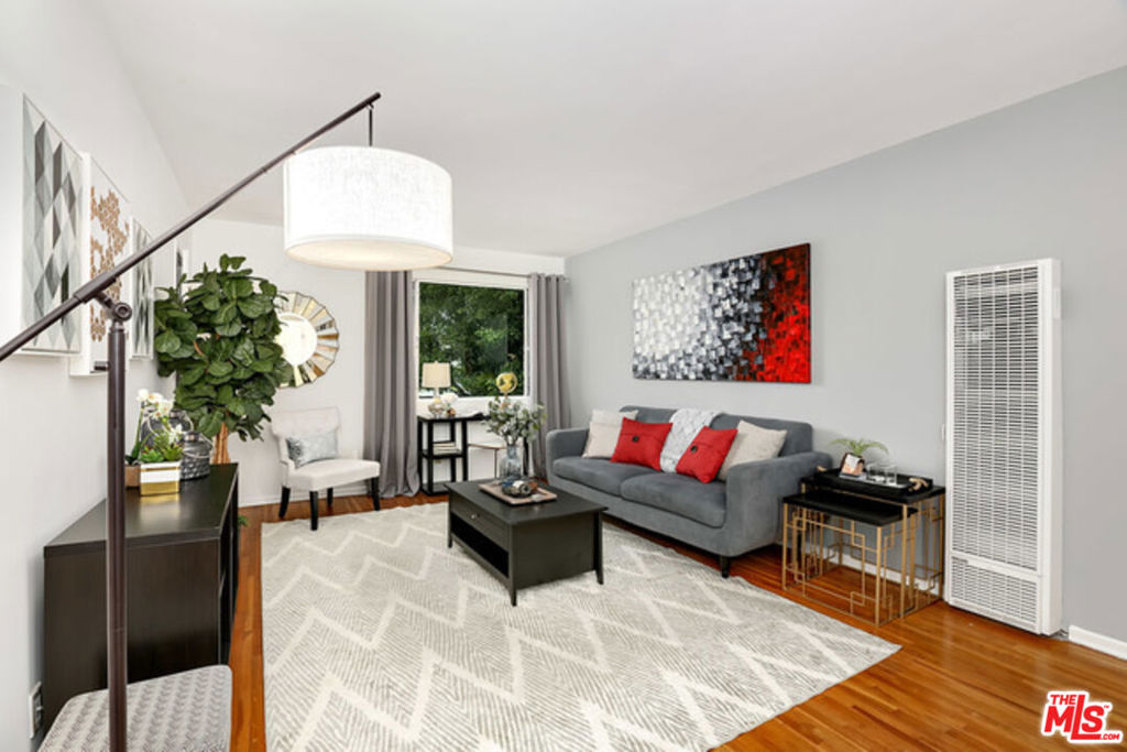 Renovated Top Floor breezy Santa Monica condo! Gorgeous kitchen with quartz counter tops, sleek back splash, stainless appliances, and tile floor. Fully updated bathroom with stylish grey hex floors, standing shower with glass door, contemporary vanity and fixtures. Great floor plan with well-sized serene bedroom with a view of the lovely courtyard. Beautifully maintained hardwood floors throughout. Patio off of the kitchen to enjoy outdoor dining. The center courtyard has lush landscaped lawn and mature trees. Close to freeways, restaurants, cafes, grocery stores, colleges. Convenient to UCLA. Only miles from Santa Monica Beach. Unit is unfurnished (photos show with previous furniture). Includes 1 assigned gated parking spot and portable AC unit. Small pet ok. Water, trash, and HOA dues are included in the rent.