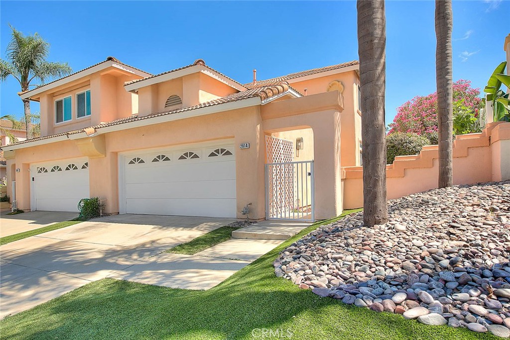 Turnkey 4 bedroom/3 bath home located in the highly desirable City of Chino Hills! Move-in ready boasting freshly painted interior and tastefully selected luxury vinyl plank flooring in the entertaining spaces of the home and neutral carpeting in the bedrooms, it shows well! Dramatic high ceilings as you enter the living room and dining space which enjoys an inviting fireplace and contemporary new lighting fixture. The cheerful kitchen shows light and bright with newly refinished/painted white cabinetry, elegant quartz counter tops, subway tile backsplash, new sink, new lighting, stainless appliances and generous counter space to work. This pleasing floorplan features the primary bedroom with on-suite bathroom on the first level of the home along with a guest bedroom and full guest bathroom on the first floor too. The primary bedroom has private access to the backyard, a tranquil setting to enjoy the foothill setting. The primary bathroom has been upgraded with refinished vanity done in white, it has dual sinks and new quartz counters, new mirrors, new lighting fixtures and a new showerhead. There is also a downstairs den which is wonderful for an informal TV room or perfect for a home office. Upstairs are 2 guest bedrooms and 3/4 bathroom with dual sink vanity. Notables included newer HVAC system (approx 3 yrs old) new baseboards, ceiling fans in multiple rooms, new blinds in the den and more! Artificial turf in the front yard and side yard is a wonderful low maintenance upgrade to this property, there are also raised planters with fresh mulch and new plants. The back patio has pavers and wrought iron fencing that allows you to appreciate the peaceful views while enjoying the privacy of the backyard. Chino Hills is known for its award winning schools, beautiful parks, hiking trails, a fantastic outdoor mall "The Shoppes" which enjoys a variety of dining and retail options, Costco & Trader Joes & more. This community has so much to offer, you won't be disappointed!