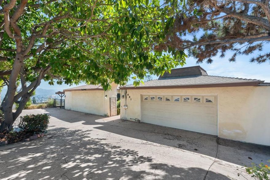 Endless possibilities await in Fletcher Hills! Perched on a ¼-acre view lot overlooking the valley, hills, and distant mountains, this 4-bedroom, 3.5-bath traditional ranch with mid-century modern influences is ready to be reimagined. The single-level floor plan spans approx. 2,546 sq. ft., featuring open-concept living spaces framed by expansive glass sliders that invite natural light and stunning panoramas.  The spacious living room showcases a dramatic wood-clad vaulted ceiling and a striking double-sided stone fireplace—a true architectural centerpiece waiting to shine again. The kitchen and dining areas flow effortlessly to the outdoor pool and deck, ideal for modern indoor-outdoor living once restored.  A 3-car garage, wide driveway, and quiet cul-de-sac setting add to the appeal, while the Fletcher Hills community provides a desirable location close to top-rated schools, shopping, and freeway access.  This home is cash-only and being sold as-is, offering a rare opportunity for investors, flippers, or buyers seeking sweat equity to unlock tremendous value. Whether you restore its mid-century charm or reimagine it with a contemporary twist, the potential here is undeniable.  Bring your vision, your contractor, and your imagination—this is your chance to create something extraordinary in one of El Cajon’s most sought-after neighborhoods.