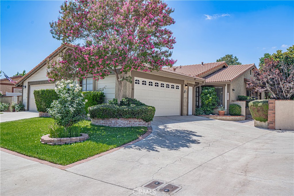 Charming 3-bedroom, 2-bath home located on a cul-de-sac in the highly desirable Sunrise community of Valencia. The living room offers vaulted ceilings, a beautiful stone fireplace, and updated light fixtures—creating a warm and inviting space.
The home has been tastefully updated with new carpet throughout, new kitchen flooring, and fresh interior paint. The large primary suite includes its own ensuite bath and a spacious closet.
The backyard is ready to enjoy with a beautiful pergola, new landscaping, and a low-maintenance design that feels both private and inviting.
Ideally situated just steps from award-winning schools, miles of scenic paseos, and multiple community parks and pools. Conveniently close to Granary Square, the Whole Foods shopping center, Valencia Town Center, and Henry Mayo Hospital. Low HOA and no Mello Roos. Move-in ready and full of charm.