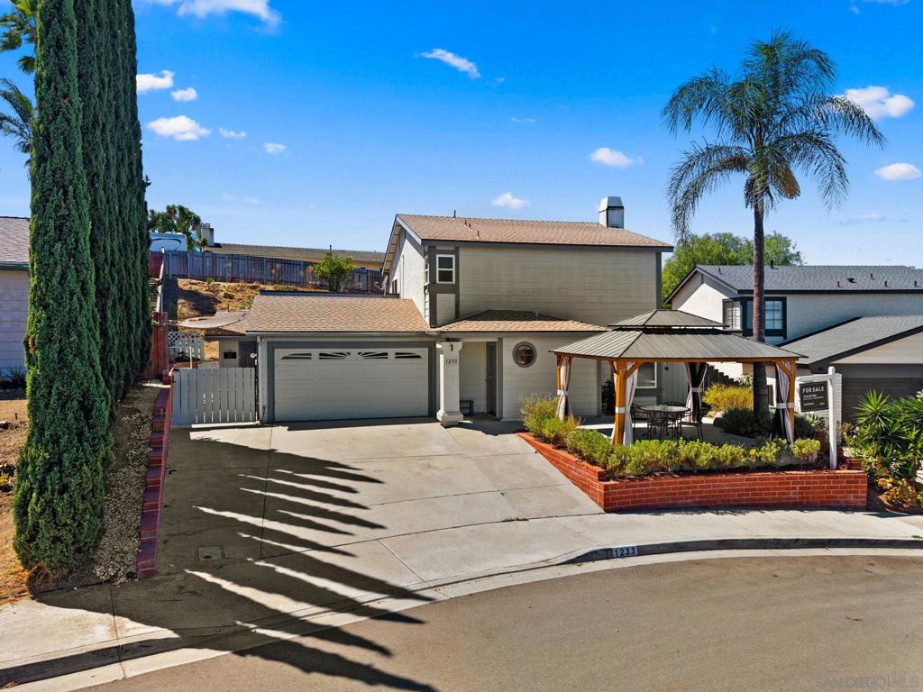 Tucked in a quiet cul-de-sac in highly sought-after South Escondido, this upgraded 4 bedroom, 3.5 bathroom property offers comfort, functionality, and income potential with an ADU generating approx. $30K/year! Inside you will find an open-concept layout with a stylish breakfast bar. Cozy up in the built-in reading nook under the staircase and stay organized with the built-in shoe shelves located near the entry. The master bath features added closet shelving and dual sinks. Energy-efficient DC motor ceiling fans in addition to central A/C keep all three upstairs bedrooms cool. The landscaping features stylish hardscaping in the front and back. A charming solid wood hardtop gazebo is surrounded by low-maintenance lavender thoughtfully situated in the front yard. The private backyard garden area has garden beds the seller is willing to leave. A fence and gate create separation between the main patio and backyard, plus an additional fence/gate offers private patio access to the ADU. The ADU features include a private entrance and a brand new mini-split system with heating & A/C. Additional features include a Tesla solar system for energy efficiency, rerouted garage electrical from a previous Tesla battery setup for expanded functionality, and a new quiet motor installed on the garage door opener. Located in a friendly neighborhood with easy access to shopping, schools, and major freeways, this move-in ready property is ideal for multi-generational living, rental income, or flexible work-from-home setups. Enjoy thoughtful upgrades throughout and a prime location. Come have