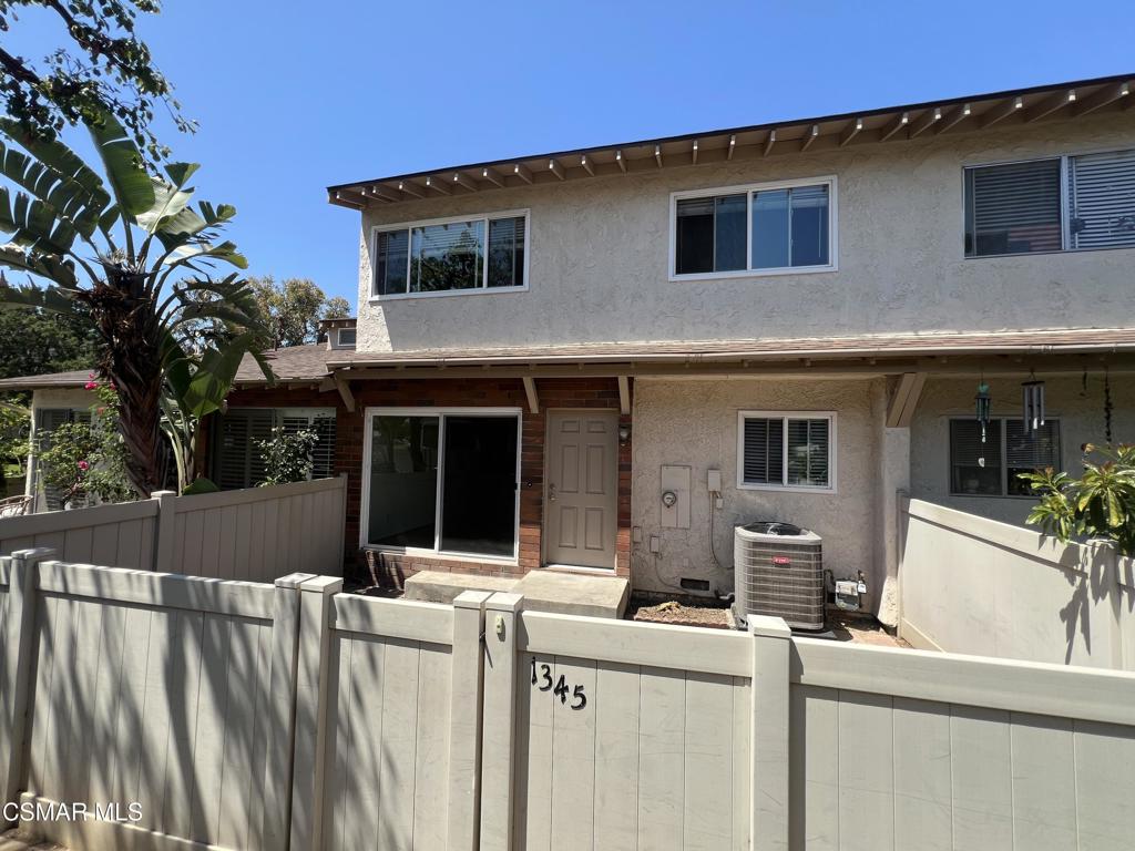 Nicely updated Townhome in quiet location within complex. This spacious tri-level home has 4 bedroom 2 bathrooms and is over 1,300 sq. ft. Kitchen features granite counters, stainless steel appliances, 5 burner range, eat-in dining area and plenty of storage cabinets. Home has wood like flooring and tile flooring throughout, new carpet on stairs and in all bedrooms, fireplace in living room, fresh paint throughout, dual pane windows, newer A/C and vaulted ceilings. Two of the bedrooms have walk-in closets. Both bathrooms have been updated as well. Brick patio in front is spacious and has opportunity for planting your own special garden.Two car garage with laundry area. Low HOA dues! Trash, pool, spa and tennis included. Close to award winning schools, parks, shopping and recreation.