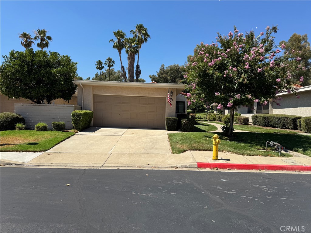 This is your chance to live in the highly sought-after Upland Hills Country Club. 1021 Pebble Beach Drive offers peaceful, golf course living with stunning views of the 4th green and San Gabriel Mountains. This single-level, well-maintained condo features an open floor plan with vaulted ceilings, a cozy fireplace, wet bar, and natural light throughout. 3rd bedroom currently set up as an office. Relax on your private patio with sunset views or enjoy the community amenities—pool, jacuzzi, putting greens, and the clubhouse—just a short walk away. Fresh paint and new carpet make this home move-in ready. Don’t miss your chance to live in this tree-lined, welcoming community where every day feels like a retreat!