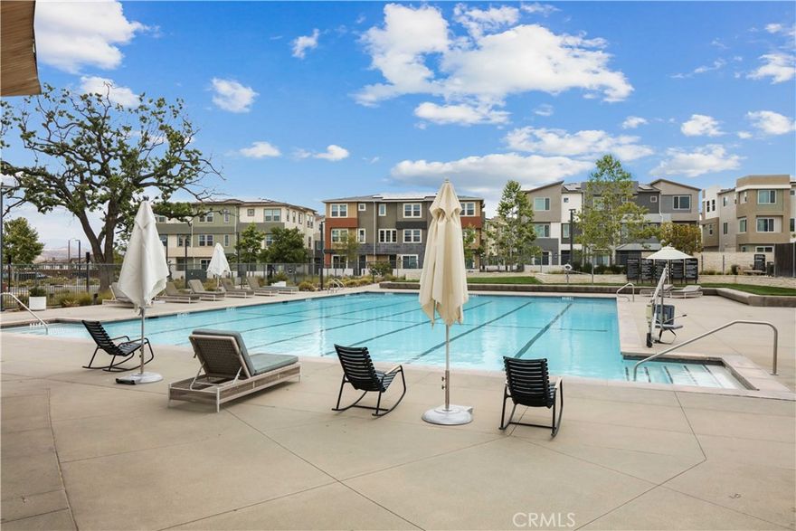 Welcome to this FHA and VA APPROVED condo, nestled in the highly sought-after Valencia Five Points Community!  Designed with both style and comfort in mind, this pristine home is your perfect retreat. Upon entering, you'll be welcomed by a beautifully open floor plan featuring a spacious living room, a pristine kitchen, and an inviting dining area! Perfect for both everyday living and entertaining. 

While extras include recessed lighting, in-unit laundry, leased solar panels, a spacious tandem 2 car garage, an additional storage closet just steps away from your front door, and a tankless water heater for energy efficiency. Most importantly, this condo has been exceptionally maintained and cared for! You’ll also enjoy resort-style HOA amenities including: 3 unique swimming pools, Outdoor fire pit with ample seating, Community Center and Garden, Picnic areas, scenic walking trails, dog stations and so much more! Located just minutes from award-winning schools, golf courses, Westfield Mall, Six Flags Magic Mountain, and with easy freeway access. Don’t miss out on this opportunity—schedule your private showing today!