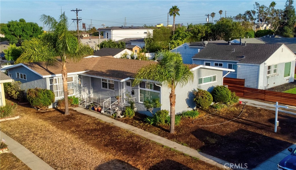 Presenting a well-cared-for duplex featuring two bright and spacious 2-bedroom, 1-bath units in a peaceful, highly desirable neighborhood of Westchester. Set on a generous 7,113 sq ft lot with mature fruit trees, this property includes a long driveway leading to a detached two-car garage. The front unit has been thoughtfully remodeled, while the rear unit offers a private backyard perfect for outdoor living and entertaining. Both units are equipped with in-unit laundry hookups, providing convenience for occupants. With its versatile layout, the property is an excellent choice for owner-occupiers seeking additional income, investors looking to expand their portfolio, or developers exploring future potential. Its central location offers close proximity to the coast, LAX, SoFi stadium, Intuit Dome, KIA Forum, and the metro station, along with easy access to Santa Monica, Venice Beach, Silicon Beach, Loyola Marymount University, SpaceX, shopping, schools, and 405/105 freeways. Make sure to not let this grand opportunity slip by, and schedule a viewing appointment today.