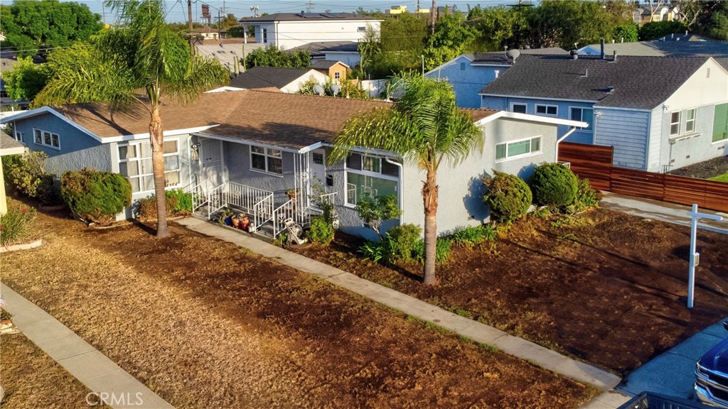 Presenting a well-cared-for duplex featuring two bright and spacious 2-bedroom, 1-bath units in a peaceful, highly desirable neighborhood of Westchester. Set on a generous 7,113 sq ft lot with mature fruit trees, this property includes a long driveway leading to a detached two-car garage. The front unit has been thoughtfully remodeled, while the rear unit offers a private backyard perfect for outdoor living and entertaining. Both units are equipped with in-unit laundry hookups, providing convenience for occupants. With its versatile layout, the property is an excellent choice for owner-occupiers seeking additional income, investors looking to expand their portfolio, or developers exploring future potential. Its central location offers close proximity to the coast, LAX, SoFi stadium, Intuit Dome, KIA Forum, and the metro station, along with easy access to Santa Monica, Venice Beach, Silicon Beach, Loyola Marymount University, SpaceX, shopping, schools, and 405/105 freeways. Make sure to not let this grand opportunity slip by, and schedule a viewing appointment today.