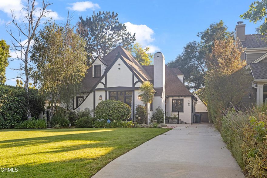 Nestled in the highly sought-after San Rafael neighborhood of Pasadena, 263 San Miguel Road is a timeless 1926 English Tudor residence that blends classic architecture with modern updates. Set on a beautifully landscaped 9,000-square-foot lot, this 3 bedroom, 2.5 bath home offers approximately 2,700 square feet of elegant living space filled with character and natural light. Inside, the formal living room makes a striking first impression with its vaulted wood-beamed ceilings, rich hardwood floors, and a stately fireplace beneath a statement chandelier. Just beyond, a gracious formal dining room with crown molding and tray ceilings opens to a remodeled chef's kitchen featuring granite countertops, stainless steel appliances, a five-burner gas cooktop, and a peninsula with bar seating perfect for everyday meals or entertaining. A cozy den or sitting room sits just off the main living area, ideal for a music room, office, or reading nook, with French doors that lead out to the fully enclosed backyard. Two generously sized bedrooms are located on the main level, alongside two well-appointed hall bathrooms. Upstairs, the primary suite feels like a private retreat with vaulted ceilings, access to a expansive and peaceful patio, and an en-suite bath. Outdoors, the lush backyard offers a tranquil escape with mature landscaping and grassy areas ideal for relaxation, pets, or play. A detached garage and additional driveway parking complete the property. Ideally located on a quiet, tree-lined street in one of Pasadena's most desirable pockets, 263 San Miguel offers convenient access to local schools, parks, the Rose Bowl and the shops and restaurants of Old Town Pasadena. This is a rare opportunity to lease a home that blends historic charm, thoughtful upgrades, and a truly special setting.