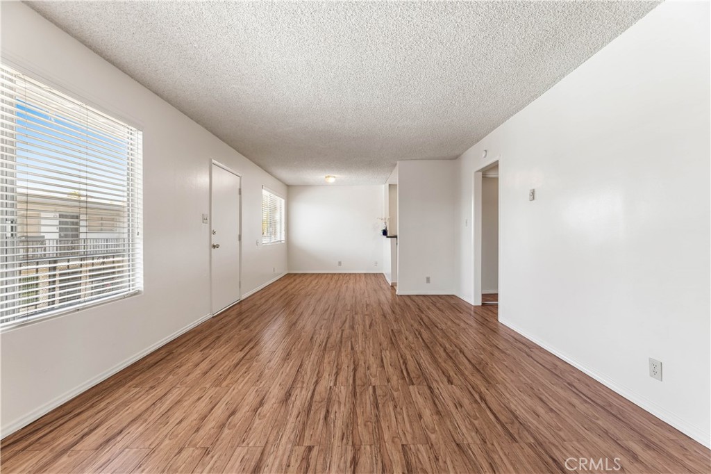 Welcome to this bright and well-maintained upstairs corner unit located in the gated community of Long Beach. With no neighbors above and only one shared wall, this home offers a level of privacy that’s hard to find in condo living.
Recently refreshed with paint throughout, the unit features modern luxury plank flooring and a bright, functional kitchen with granite countertops, ample cabinet space - perfect for daily living or entertaining. The primary bedroom includes two closets, providing generous storage.
This home includes an assigned carport space to ensure hassle-free parking, and residents enjoy access to community amenities such as a sparkling pool and on-site laundry.
Centrally located near the 91 and 710 freeways, you're just minutes from Lakewood Mall, parks, schools, and the beach—putting shopping, recreation, and everyday essentials within easy reach. Whether you're a first-time buyer, downsizing, or investing, this turnkey home is a fantastic opportunity in a well-kept Long Beach community. Schedule a viewing today!