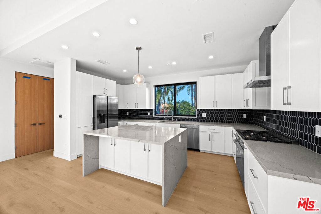 **3 BEDROOM + OFFICE + 2.5 BATHROOM + PRIVATE ROOFTOP DECK & 2 CAR GARAGE! PRIME LOCATION! CENTRAL A/C, WASHER/DRYER IN-UNIT, PET FRIENDLY** Experience modern luxury in this brand new townhome that blends sophisticated design, open-concept living, and unbeatable city views. Featuring 3 spacious bedrooms and 2.5 elegant bathrooms, this home is thoughtfully crafted for both comfort and style. Soaring ceilings, oversized windows, and premium finishes create a bright and inviting atmosphere throughout. Enjoy seamless indoor-outdoor living with a private rooftop deck offering sweeping panoramic views perfect for entertaining, relaxing, or watching the sunset. Additional highlights include a full-size in-unit washer/dryer, central A/C and heat, and a private 2-car garage with direct access. Nestled in a prime location near the vibrant heart of Los Angeles, you'll have easy access to top dining, shopping, and entertainment destinations. Whether you're hosting guests on the rooftop, exploring the neighborhood, or enjoying the tranquility of your new space, this home offers the best of city living. Pet-friendly and newly constructedthis is more than just a rental, it's your next home. Schedule a showing today! *Photos may vary.*
