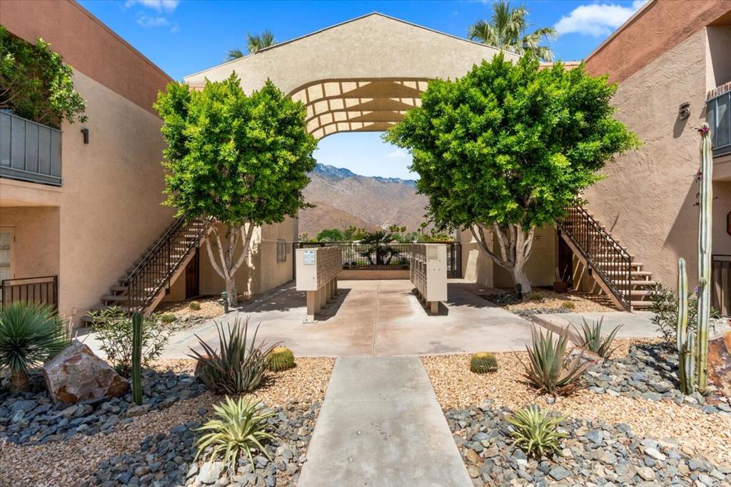 Positioned on the second floor of a gated, beautifully maintained community, this TURNKEY one-bedroom, one-bath residence is an exceptional opportunity whether as a full-time home, seasonal retreat, or income-producing asset. Offered FULLY FURNISHED, the unit opens onto a private patio with tranquil views overlooking one of the community's sparkling pools. Inside, the updated interiors reflect thoughtful design and comfort, with a welcoming layout and natural light throughout. The kitchen and living area connect seamlessly to the outdoor space, creating a perfect setting for morning coffee or evening relaxation.Residents enjoy access to resort-style amenities, including three pools and spas, a fitness center, a clubhouse, and manicured grounds. The complex is pet-friendly and includes assigned covered parking. The HOA covers water, gas, trash, and exterior maintenance for added convenience.Ideally located in central Palm Springs, this residence offers proximity to renowned shopping, dining, and cultural attractions while sitting on FEE LAND, with NO LAND LEASE to consider. With a 30-day minimum rental policy, the property presents both flexibility and potential.This is a rare chance to own a furnished and move-in ready condo in one of California's most iconic destinations.