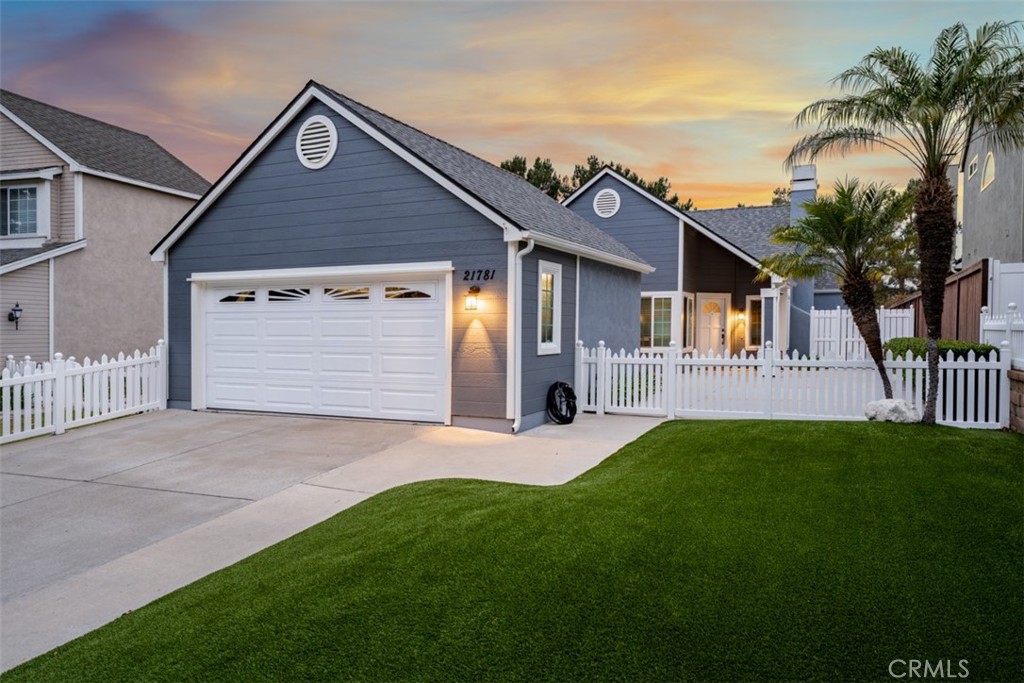 Welcome to 21781 Brentwood, a beautifully updated single-story home in the highly desirable Evergreen Lakeview community of Mission Viejo. This 3-bedroom, 2-bathroom residence offers a roomy, welcoming feel with abundant natural light and comfortable living spaces. The living room features a cozy fireplace, perfect for relaxing evenings at home. The kitchen offers plentiful cabinetry, a functional layout, and a built-in breakfast/dining nook with storage — ideal for casual meals and family gatherings. A bonus room provides versatile space for a home gym, office, dining room, or kids’ playroom. The primary suite serves as a peaceful retreat with a walk-in closet and spa-like ensuite bath. Outdoor living is equally inviting with a covered patio for al fresco dining, sunrise coffee, or sunset views, plus a gated front area and gated backyard perfect for pets or entertaining. Residents enjoy access to Lake Mission Viejo amenities, scenic hiking trails, and beautifully maintained community grounds. With low HOA, this is an exceptional opportunity in one of Mission Viejo’s most sought-after neighborhoods.