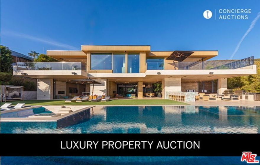 LUXURY PROPERTY AUCTION: June 24th. No Minimum Bid Required. An extraordinary contemporary masterpiece awaits at 11870 Ellice Street, where ancient wisdom meets modern luxury on one spectacular acre overlooking the Pacific Ocean. This architectural marvel features a breathtaking ninety-five-foot infinity pool with unobstructed ocean views, six private bedroom suites, each with dedicated terraces, and resort-inspired amenities designed for grand-scale entertaining. Completed in 2022 with super-engineered concrete construction built to last centuries, this unique estate embodies the vision of MKH Developments through meticulous Feng Shui principles and Indonesian-inspired design elements. Hand-carved natural stone walls, a two-thousand-gallon aquarium, a twenty-thousand-gallon koi pond, and floor-to-ceiling motorized glass walls create an immersive sanctuary where indoor and outdoor living seamlessly converge.