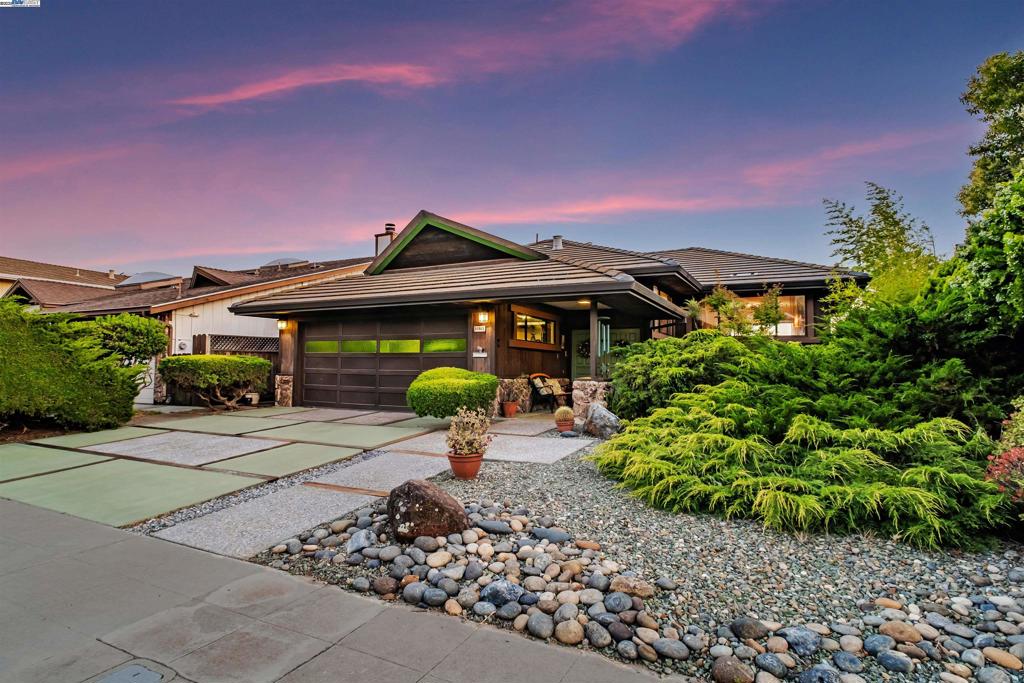 Seldom Available Custom Home w/Unparalleled Views, A Hilltop Sanctuary Awaits. Where luxury, architecture, and nature converge in perfect harmony. Perched atop a hillside, this masterpiece offers breathtaking panoramic views! A grand foyer highlighted by striking 2-sided built-in aquarium sets the stage. The top floor, both elegant & easy living, features a formal living room, dining area, chef's kitchen, family room & step-down wet bar—perfect for gatherings. Brazilian hardwood floors flow throughout, adding warmth and richness to the contemporary layout. Second floor offers bdrms w/direct access to the expansive decks through sliding doors. Plus remodeled laundry room & hall bthrm. Spacious primary suite is a true retreat with a large walk-in closet, remodeled bthrm w/modern finishes. Elegant hickory floors continue throughout this level. The outdoor third level is a dedicated space for peace, creativity, and meditation. This tranquil area invites nature to flow seamlessly in the surrounding outdoor space, where you can dream of a secret garden or artist’s retreat. More than just a home, it’s a once-in-a-lifetime opportunity to live in a space that inspires, calms, and captivates. And New Haven Unified School District is a BIG plus!