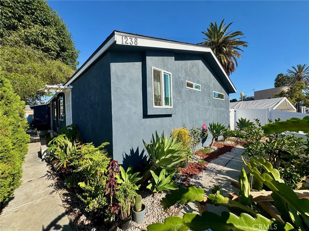 Make a smart move with this snazzy, turnkey Duplex in the up-and-coming Wilmore district of Long Beach. Live in one unit and rent out the other to cut your mortgage payment in half and reap the benefits of becoming a new landlord or add an impressive R-4 property to your existing portfolio. Each unit comes with a two-car garage, as well as a tandem parking space off the alley. There are numerous upgrades, including a new roof, complete exterior stucco, dual-pane windows, keyless entry doors, two water heaters, fresh landscaping with a 6-foot white vinyl fence, exterior and interior painting, and three TCL brand mini-split systems per unit. Inside, you’ll enjoy vaulted ceilings, SPC oak floors by Republic, baseboards, modern chandeliers, and wall sconces. The back unit features high-end stainless-steel appliances and includes a washer and dryer, as well as a wall-mounted television. The kitchens boast Knotty Alderwood cabinetry, high-end Acacia butcher block counters, a 3D tile backsplash, a stainless-steel sink, dishwasher, microwave, and recessed lighting. Finally, the bathroom is outfitted with beautiful veinous Carrera marble and a floating vanity featuring an LED mirror with a built-in defogger. It makes sense to buy two completely renovated units, with the potential to add more, rather than being stuck with just one, as a home should always be considered an investment that holds the key to your future.