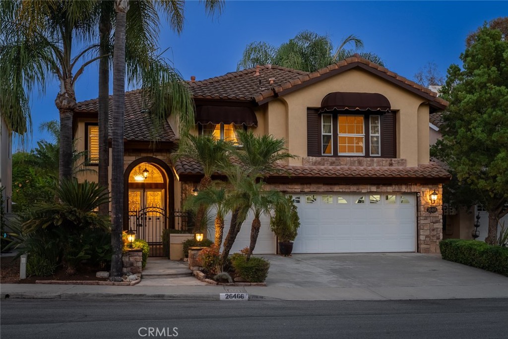 Welcome to your forever home!! This beautifully maintained home is nestled towards the end of a cul-de-sac within the highly coveted Califia tract in South Mission Viejo. This 2 story Mediterranean style home boasts 2539sqft of living space with 4 bedrooms + bonus room that can be converted into a 5th bedroom and 2.5 baths. Craftmanship and elegance is displayed as you walk through double doors with clear and beveled leaded glass windows. Enter into the living room with travertine floors, vaulted ceilings with multiple windows appointed with plantation shutters, offering the best natural light to brighten the home. A seamless transition straight into the dining room with French door access to the back yard patio and wrought iron accents into the kitchen area. The warm and spacious kitchen design includes dark cabinetry and island, granite countertops and finished with travertine style backsplash and stainless steel appliances. The open kitchen to family room area is ideal for entertaining or serene ambiance by the fireplace. Elegant finishes continue with the wrought iron spiral staircase and high chandelier leading up to the second floor. New carpet on the stairs and bedrooms, as well as new interior paint. Walk into your large master bedroom and ensuite bathroom, with large windows, plantation shutters, high ceilings and direct access to additional sitting or office area with closets and can be converted into a 5th bedroom. French door access to a balcony overlooking the back patio and surrounded by tall greenery for added privacy. Walk into your own little personal spa with a large jetted corner bathtub and overhead chandelier and large privacy windows to soak in comfort. 3 more bedrooms and an additional bathroom finish off the upstairs. Separate laundry area downstairs with access to side patio area and next to the spacious 3 car garage with epoxy flooring. You can keep your home cool and comfortable with peace of mind thanks to the 4.75 kw solar system and 2 year old HVAC system. Add to that a Waterboy whole house water filtration and conditioning system and a newer water heater for your benefit in the years to come. Add to this award winning schools that the area has to offer, including Bathgate Elementary within walking distance. Close proximity to all the shopping, dining and amenities Mission Viejo has to offer! Lake Mission Viejo access with summer concerts, movies and fireworks. There is also a beach club and paddleboarding/boating!
