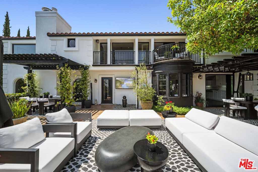 Situated in the prestigious Sunset Strip area, this fully renovated Spanish modern 1936 masterpiece awaits you. Upon entering, you are greeted by the impressive foyer, hardwood flooring, and lots of natural light. The attention to detail in this ~3,623sft, 4bd/4ba home is evident with high-end finishes that create a luxury living experience. The formal layout includes a large living room with a beautiful fireplace, a dining room, full wet bar with a television that creates the perfect lounge area. The bar and kitchen access a side patio and garden. The gourmet kitchen has marble countertops and top-of-the-line appliances. Upstairs includes a comfortable media room, two guest bedrooms, a full bath, and a primary suite. The primary suite is a true retreat, complete with a fireplace, his and her walk-in closets, and his and her stunning bathrooms. Step outside to a private oasis with city views, BBQ, dining, and lounge areas. This is the perfect outdoor space for entertaining or relaxing. The lower level includes a large laundry room with two washers and two dryers, fitness room, lots of storage, and a two-car garage. Close to the most popular restaurants, shops, and nightlife that the city has to offer.