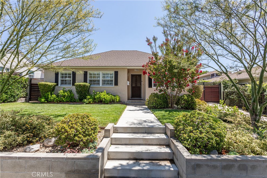 Welcome to 2958 N Buena Vista Street – a timeless hillside gem in the heart of Burbank that blends classic charm with everyday comfort.
Set behind a manicured lawn and raised planter beds, this home offers instant curb appeal with its shutter-trimmed windows, mature trees, and welcoming front walkway. Step inside and you're greeted by a warm, light-filled living room where engineered wood floors add a touch of contemporary polish while complementing the home's original character.
The layout flows seamlessly into the dining area and continues toward the heart of the home—where a wall of sliding glass doors retreats to the backyard, creating a natural indoor-outdoor connection that’s perfect for entertaining or simply enjoying the breeze.
Tucked just off the main living space, the kitchen offers vintage charm with crisp white cabinetry, tiled countertops, and a cheerful backsplash. A large window above the sink frames a view of the side and lets the natural light pour in.
Two bedrooms are conveniently located downstairs, each featuring original hardwood floors, along with a full guest bathroom thoughtfully placed for privacy and ease. Upstairs, two additional bedrooms are comfortably carpeted, offering a quiet retreat from the main living areas. The second full bathroom is cleverly designed with dual access—connected both to the hallway and one of the bedrooms—functioning as a shared ensuite with extra versatility. A beautifully preserved natural wood staircase ties the two levels together with classic charm.
In the rear, a gated driveway leads to a detached two-car garage, offering secure parking and potential for future use as an ADU, gym, or workspace. The backyard is peaceful and private, offering plenty of room for outdoor dining, gardening, or play.
Nestled in Burbank’s coveted hillside neighborhood, this home is just minutes from top-rated schools, beloved parks, studios, and the local favorites of Magnolia Park.
Whether you’re looking to settle down or scale up, 2958 N Buena Vista Street is a rare blend of comfort, character, and location.