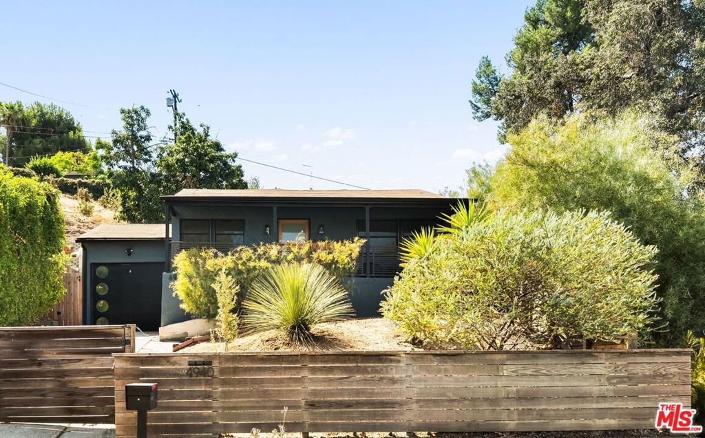 This 2-bedroom, 2-bathroom home is set on a quiet hillside street in El Sereno and offers a rare combination of privacy, natural light, and thoughtful upgrades. With original hardwood floors, central air and heat, and a layout that feels both functional and bright, the home is surrounded by greenery and filled with a deep sense of calm - bird song included.A detached 100-square-foot studio sits above the main house in the garden, tucked into the hillside with expansive views. It's the perfect retreat for a home office, creative studio, or quiet workspace completely separate from the main home and surrounded by fruit trees and sky.The garden features a variety of mature, producing fruit trees including avocado, Meyer lemon, orange, plum, nectarine, fig, lime, pomegranate, and apple cactus all supported by a smart irrigation system. Additional modern upgrades include an EV charger, a high-efficiency tankless water heater, and major system improvements. The sewer line was relined in August 2025, and foundation repairs were completed by Foundation Works in September 2025.Parking includes a 1-car garage plus space for two additional vehicles in the driveway.The location offers easy access to nature, with Ascot Hills Park's 93 acres of hiking trails and panoramic DTLA views just minutes away, along with Elephant Hill, a cherished local open space known for its scenic walking paths and ecological significance. It's a rare combination of hillside tranquility and city access.You're also within a short stroll to neighborhood favorite Lil' East Coffee and part of the El Sereno Social Club community bringing neighbors together through local events, small business support, and a shared love for this creative, evolving corner of Northeast LA.