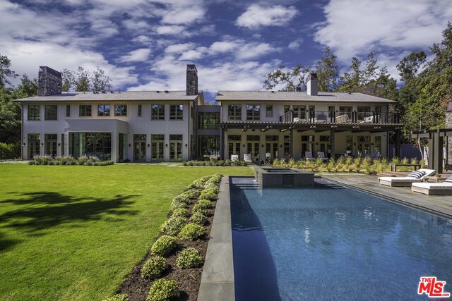 This brand new Estate located in the prestigious area of Rustic Canyon sits on an ultra-private flat one-acre lot, surrounded by towering sycamore and redwood trees, butterfly gardens and a charming creek running along the back of the property. Behind its gates rests a stunning European Farmhouse designed by AIA Mcllelan Architects in conjunction with interior designer Eliana Rokach. The equestrian-inspired Estate is made for entertaining, offering a 3,000 SQ FT master suite wing, covered parking for 10 cars and gated uncovered parking for at least 20 more, gourmet kitchen and auxiliary kitchen, a stunning pool house, 50' infinity pool with spa, an enchanting tree house and ample outdoor and indoor gathering areas. The home comprises two wings joined by an interior footbridge surrounded by Steel Belgian doors and enjoys views of the expansive lush gardens from almost every room. Just minutes from the beach and from Palisades Village, this estate redefines luxury.