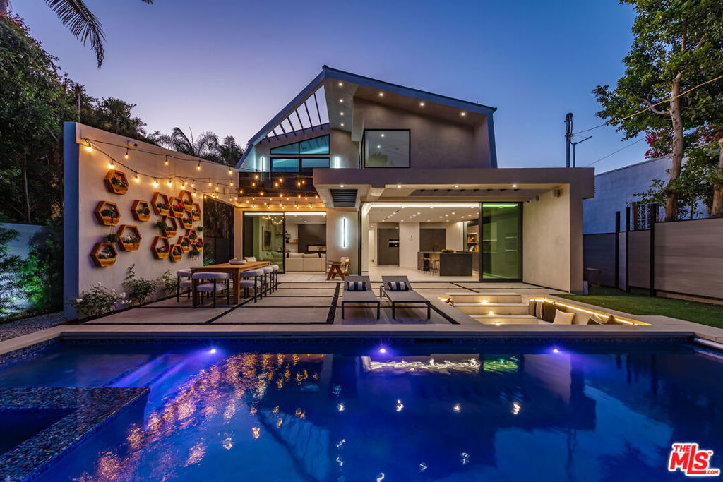 A Visionary Masterpiece by Amit Apel Design The Crown Jewel of La Jolla Avenue, where architectural brilliance meets modern luxury. This newly constructed modern showpiece redefines elegance with bold design, seamless indoor-outdoor flow, and cutting-edge amenities. Located in the heart of West Hollywood, 930 N La Jolla Avenue isn't just a residence - it's a statement. From the moment you enter, you're greeted by an expansive open floor plan and a dramatic black glass floor feature that draws your gaze to the lower level. The formal dining room stuns with a show-stopping chandelier, elegant fireplace, and floor-to-ceiling glass wall. The sleek living room connects effortlessly to the gourmet kitchen, showcasing German cabinetry, an oversized eat-in waterfall island, top-tier Miele appliances, and striking Dekton countertops. Disappearing glass walls create a fluid transition to the entertainer's dream backyard: a sunken fire pit lounge, smart pool and spa with micro-LED lighting, built-in cover, and generous outdoor space for al fresco living. Upstairs, the luxe primary suite is a true sanctuary - soaring 14-foot vaulted ceilings, a private balcony, spa-like bath with soaking tub and glass shower, dual floating vanities, and two expansive walk-in closets. Each guest bedroom includes an en suite bath, with two offering private balconies and serene views of the Hollywood Hills. Below, a rare 2,000 sqft basement offers unmatched flexibility: a soundproof home theater (or future music studio), multiple living areas, bonus rooms for guests, gym, or office, plus a Clear Canadian cedar sauna with Himalayan salt insert and IPE flooring. Outfitted with premium technology and materials including Fleetwood doors/windows, a 'Zoeller' pump system, triple-zone HVAC, central audio, Wi-Fi extenders, and more - this one-of-a-kind home delivers both luxury and lasting quality in one of L.A.'s most coveted neighborhoods.