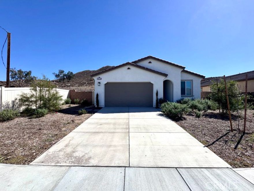 Welcome to this stunning single story, newly built Winchester home available for lease, featuring numerous upgrades throughout! Ideally located, this home offers 3 bedrooms, 2 full bathrooms, over 1,560 sqft of living space, solar, and a 2 car garage with epoxy flooring. Enter inside to find an inviting open floorplan highlighted by upgraded luxury vinyl plank flooring. Just off the entryway is a versatile bedroom, perfect for guests, a home office, or a flex space. The spacious kitchen is the heart of the home, showcasing upgraded shaker style cabinets, quartz countertops with a matching backsplash, a large center island, and a walk-in pantry. The kitchen seamlessly opens to the dining and family room areas, where large windows fill the space with natural light, making it ideal for both everyday living and entertaining. From the kitchen, a hallway leads to a full bathroom and an additional spacious bedroom. Each bedroom is thoughtfully designed with ample closet space and upgraded dimmer lighting, adding both comfort and convenience. The primary suite, located just off the family room, offers abundant light, ample space, and a private ensuite bathroom with dual sinks, a large walk-in shower, and a generous walk-in closet. Additional highlights include a convenient laundry room off the kitchen, complete with washer and dryer, and a backyard that will soon be finished with a concrete slab, turf, and plenty of room to enjoy outdoor living. Don’t miss the opportunity to lease this beautifully upgraded home, schedule your showing today!