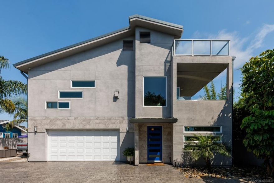 Custom-built contemporary masterpiece in the historic Loma Alta neighborhood with INCREDIBLE VIEWS. Just 2 miles from the beach and walking distance to Buddy Todd Park. Completed in December 2017, this 3,435sqft luxury home was thoughtfully designed to capture panoramic ocean and mountain views from every level. Owned Solar & EV charging, dual Zoned AC, tankless water heater & metal roof. The entry-level offers two spacious bedrooms, a large Jack-and-Jill bathroom, kitchenette, and family room with French doors leading to a lush, low -maintenance backyard featuring synthetic turf and a 1,000-gallon rainwater storage system.  Upstairs, the open-concept main living area boasts soaring 10’ ceilings, a chef’s kitchen with waterfall-edge quartz island, KitchenAid stainless appliances, walk -in pantry, and beverage station. The living room includes a linear gas fireplace and a 13’ panoramic glass wall system that opens to a covered lanai with sweeping views. The luxurious primary suite features a freestanding tub, dual vanities, walk-in closets, and ocean-view deck access. Additional highlights include an 871sqft rooftop deck with a glass wall for unobstructed views of the ocean and mountains! A gated driveway, oversized 4-car garage with epoxy floors , bonus half-bath, and extra laundry hookups. High-efficiency HVAC, central vacuum, premium finishes, fire sprinklers, and upgraded structural elements provide both comfort and safety. Easily adaptable for a 4th bedroom. Truly a rare opportunity to own a one-of-a-kind modern coastal home.