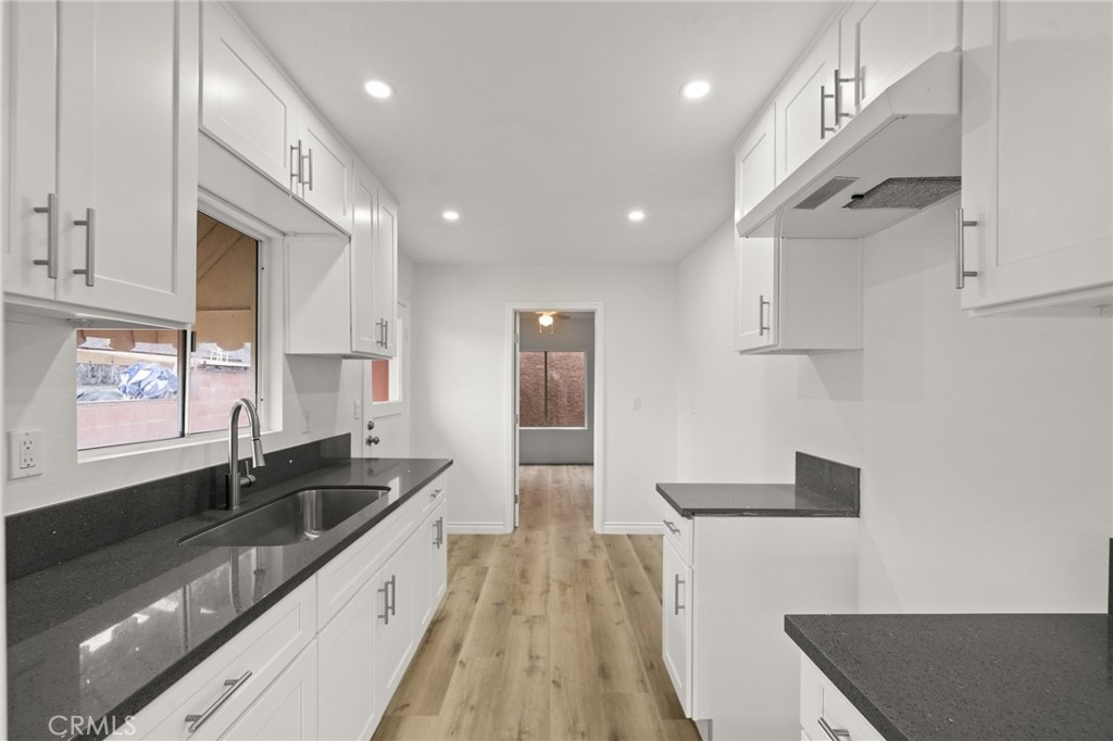 Welcome to your private retreat at 6816 Bear Ave, Bell, CA 90201! This fully remodeled 2-bedroom, 1-bath home combines modern comfort with a peaceful, secluded setting. Located on a quiet flag lot, it offers a tranquil atmosphere away from the street. Recent updates include a new roof, stylish kitchen with granite countertops, new flooring, energy-efficient windows, and a new laundry room. Enjoy your private yard and the convenience of being within walking distance to local schools, shops, restaurants, and public transport. Despite the peaceful setting, you're just moments from everything you need. The private driveway adds extra exclusivity. Don’t miss this rare opportunity!