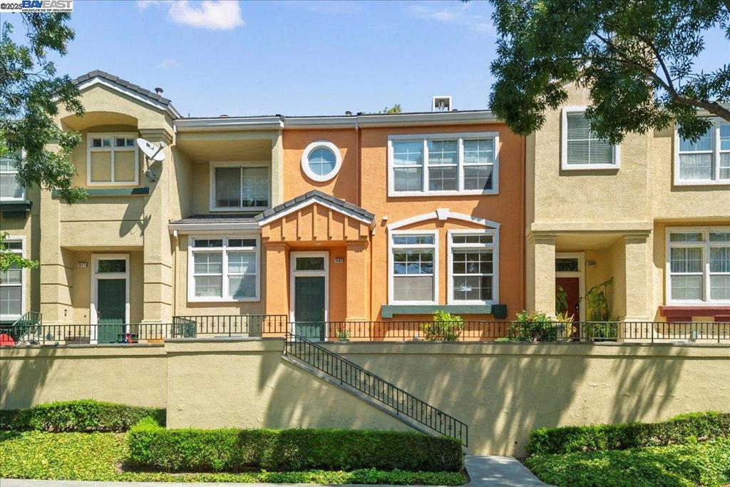 Stunning 3 bedroom townhouse in Liberty Commons, one of Fremont's most desirable gated communities. In move-in condition, this unit features updated kitchen w/white cabinets, quartz countertops, mosaic tile backsplash, breakfast bar & newer stainless steel French door refrigerator, gas range & dishwasher; spacious, bright living room w/natural light, fireplace, built-in shelving & 65" flat screen TV; formal dining room; primary bedroom w/vaulted ceiling, large walk-in closet & en suite bathroom w/dual sink vanity, bathtub & stall shower; beautiful refinished Chinese maple flooring on main floor & newer eucalyptus flooring upstairs; dual pane windows & blinds; six panel doors w/new satin nickel levers; newer central heating & air conditioning; newer water heater; Smart Home features: Nest thermostat, wired Nest smoke alarms/CO detectors, front porch irrigation system, MyQ garage door system & Ring doorbell; charming front porch w/sitting area & planters; extra-deep 2 car garage w/roll-up door & opener, storage cabinets, shelves, refrigerator & Tesla EV charger. Resort-style community features swimming pool, spa, clubhouse & ample guest parking. Centrally located near Fremont's Downtown District w/easy access to 880 & Silicon Valley employment. Open House 8/30 & 8/31, 1:00-5:00 PM