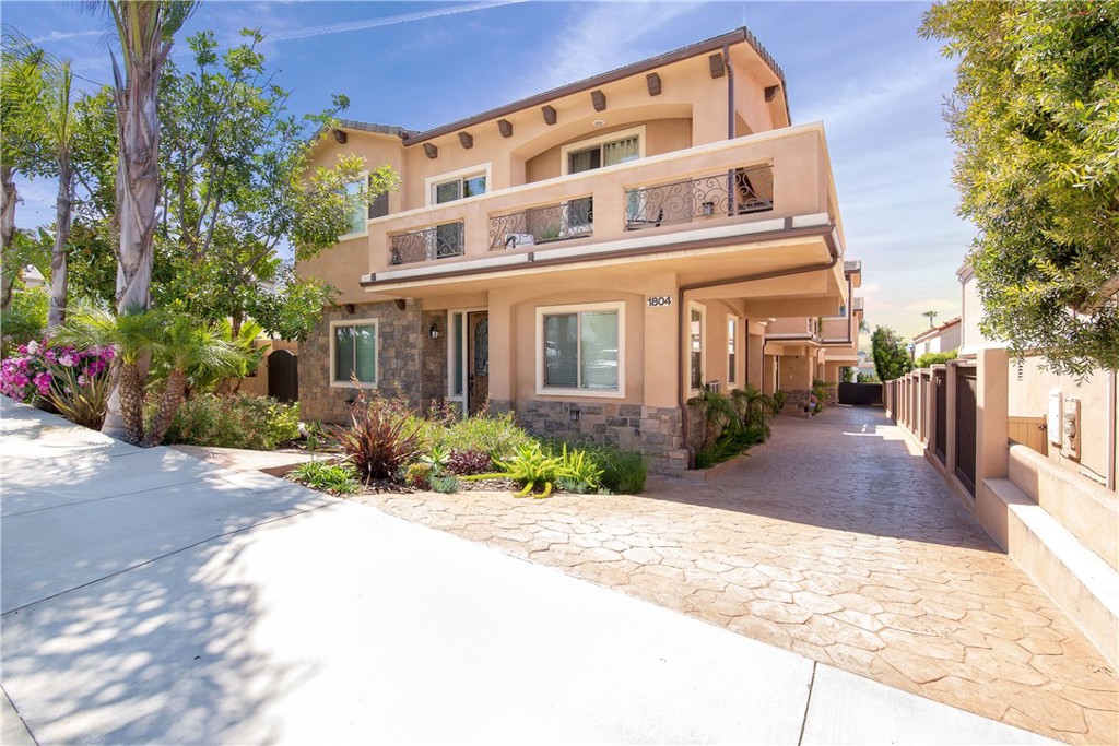 Welcome to this beautifully upgraded 4-bedroom townhome nestled in the heart of Redondo Beach, where coastal charm meets modern comfort and functionality. The entry level offers two spacious bedrooms, a full bathroom, laundry closet, and direct access to a 2-car garage—perfect for added privacy and everyday convenience. Upstairs, the main living area boasts an open and airy layout ideal for both entertaining and daily living. Soaring vaulted ceilings with custom wood beams, crown molding, fireplace and a built-in home theater system create a warm yet refined atmosphere. The remodeled gourmet kitchen is a true showstopper, featuring sleek quartz countertops, stainless steel appliances, and a breakfast bar for casual dining or entertaining. The main living level includes the primary suite offers a private retreat with high ceilings, exposed beams, custom window treatments, and a spa-inspired ensuite bath with dual sinks, a soaking tub, and separate glass-enclosed shower. A fourth bedroom and an additional full bath complete the upper level, providing flexible space for a home office, nursery, or guest room. Step outside to your private, west-facing balcony to unwind with treetop neighborhood views and ocean-kissed sunsets—an ideal spot for morning coffee or evening relaxation.
Additional highlights include central A/C, Paradigm luxury vinyl flooring, ceiling fans in every bedroom, and a Nest security camera system. Situated just minutes from Andrews Park, local shops and restaurants, award-winning schools, and world-famous South Bay beaches, this turnkey townhome offers the best of coastal California living.