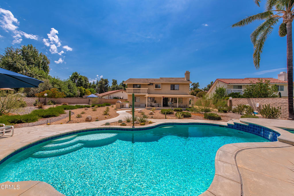 Welcome home! Beautiful 4-bedroom, 3-bath home perfectly situated in one of Simi Valley's most sought-after neighborhoods. Ideally located near Rancho Tapo Community Park, Simi Valley Library, Boys & Girls Club, farmers market, & more, this property offers both convenience and lifestyle.Set on an expansive 15,246 sq. ft. lot, the home features a resort-style backyard complete with a sparkling pool & spa, covered patio, built-in barbecue, and plenty of open space for entertaining. There's also gated RV parking and drought-tolerant landscaping for easy maintenance.The versatile floorplan includes a downstairs bedroom and 3/4 bath, ideal for guests, a home office, or multigenerational living. Upstairs, you'll find 3 additional spacious bedrooms, including the primary suite with a private balcony, walk-in closet, dual vanity, soaking tub, and separate shower.At the heart of the home is a chef's kitchen with a six-burner stove, walk-in pantry, expansive granite countertops with large eating bar, and abundant cabinet space. The kitchen flows seamlessly into the family room with an upgraded fireplace, creating the perfect gathering space. Formal living and dining rooms offer even more flexibility for entertaining.Additional highlights include an indoor laundry room and a 2.5-car garage with convenient 3-door entry. This is the perfect blend of comfort, function, and resort-style living. Don't miss the chance to call it yours!