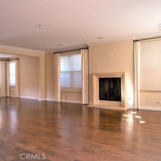 This gorgeous single family home is ideally located on a corner lot across from the community park in Woodbury, Irvine.   Bright and open floor plan with warm color hardwood floors and upgraded carpeting.    It has an ample size office/den downstairs with nice built-in book shelves plus three more bedrooms upstairs.    Gourmet kitchen features an oversized center island with granite countertops, stainless steel appliances, a five burner cooktop,  oven and microwave.   The great room has an oversized stone fireplace, opens to formal dining room and living spaces.    Upstairs master suite has a large walk-in closet, master bath with dual sinks and a bath tub with walk-in shower.   Full driveway with two car direct access garage. 
Enjoy the resort style amenities with many swimming pools, parks and tennis courts that the Woodbury community offers.  
***Woodbury Town Center nearby that is convenient for shopping and dining.  Walking distance to the Woodbury Elementary school.