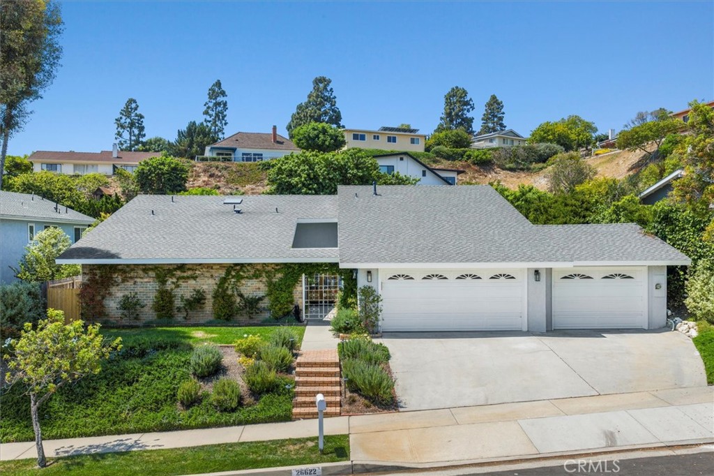 Redesigned by acclaimed Archer Building Group—known for their high-quality, detail-oriented craftsmanship. | Rare Single-Level 5-Bedroom Retreat on a cul-de-sac in the prestigious Blackhorse neighborhood in RPV. This five-bedroom, three-and-a-half-bath residence spans 2,475 square feet on a generous 9,693 square foot lot, offering a seamless blend of contemporary design, functionality, and privacy. Inside, the home features wide-plank flooring, recessed lighting throughout, and newly installed skylights that bathe the living areas in natural light. The formal entry was reimagined for openness, and the living room entry was enlarged to create better flow throughout the space. A custom built-in bar with beverage fridge anchors the entertaining area, complemented by a modern gas fireplace. The chef’s kitchen is outfitted with custom soft-close cabinetry, a 6-burner Ilve range with center griddle, and integrated Fisher & Paykel refrigerator and dishwasher. Electrical outlets are discreetly hidden inside cabinets for convenience and clean design. Each bedroom has been upgraded with new custom closets with electrical and thoughtful lighting. The spacious primary suite features raised ceilings, a new window for added light, a walk-in closet with full custom cabinetry, and a completely remodeled bathroom with premium finishes and an outlet by the toilet for added flexibility. Significant structural and systems upgrades include all-newer plumbing, including a new sewer line to the street; updated electrical and subpanel in the garage; HVAC system and air conditioning; and a tankless water heater for on-demand efficiency. Garage is equipped with 220V EV charging outlets, and smart garage door openers have been installed. Additional improvements include a built-in surround sound system, a Ring-enabled alarm system, new backyard pavers, fresh landscaping in both front and back, and an above-ground hot tub. Even the laundry room features a built-in access hole for kitty litter or dog bed, reflecting the thoughtful customization found throughout the home. The backyard was extended by approximately eight feet to enhance both outdoor space and privacy, and the home enjoys complete seclusion with no visible neighbors.