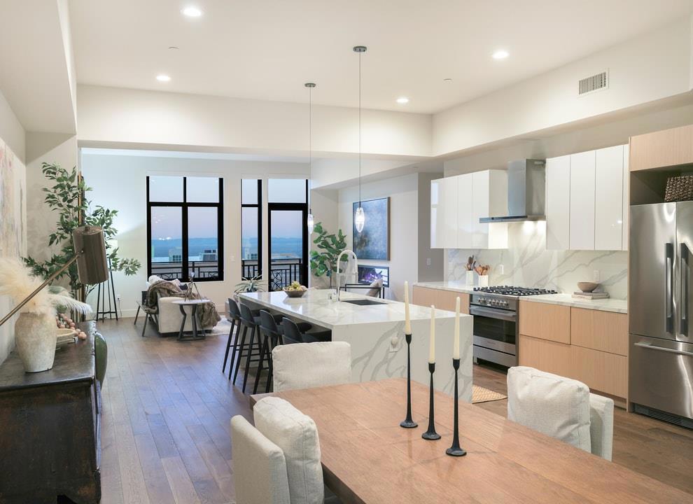 Welcome to this state-of-the-art condominium on the third floor of The Holman in downtown Pacific Grove. With an open-concept layout and soaring ceilings, this prime residence instantly captivates visitors with staggering ocean views and luxury custom finishes throughout. Pass a laundry room, a half bathroom, and an open office space on your way to an impressive kitchen featuring a walk-in pantry, a waterfall island, pristine white cabinetry, and high-end stainless-steel appliances. Sip coffee at the breakfast bar, your eye following the sailboats as they glide leisurely through Monterey Bay. At the far end of the unit, a towering wall of windows insulates the living room, granting access to an oversized balcony from which to feel even more immersed in the enchanting sights and sounds of the Monterey Peninsula. Two spacious bedrooms are on opposite sides of the main living area, ensuring privacy and granting additional panoramic views of the Pacific Ocean through massive windows. Each bedroom has its own en suite bathroom with a walk-in shower. Living on Lighthouse Avenue in a historic building, you are truly just steps from fine restaurants, art galleries, specialty shops, a movie theater, a library, multiple parks, and so much more awaiting discovery. Come make it all yours.