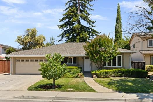 Welcome to classic single-level living in San Jose's charming Berryessa neighborhood! Ideally located across from Penitencia Creek County Park, this beautifully maintained home offers comfort, space, and functionality throughout. Inside you will find a well-designed floor plan with wood flooring and multiple gathering areas, including a spacious living room and a separate dining room, perfect for both everyday meals and special occasions. At the heart of the home is a thoughtfully remodeled entertainers kitchen, featuring an open layout that flows seamlessly into the family room. Enjoy a large center island with sleek granite countertops, stainless steel appliances (including an induction cooktop, oven, microwave, dishwasher, and exhaust hood), plus abundant cabinetry, a separate pantry, and a built-in hutch. Ideal for all your culinary needs. This home offers four generously sized bedrooms, including a relaxing primary suite, along with two updated bathrooms with granite counters and tiled showers. Step outside to your private backyard retreat and expansive, fenced yard with a large deck, pergola, perfect for outdoor dining and entertaining. Additional highlights include shutters on windows, a separate laundry room and an attached two-car garage with ample storage space.