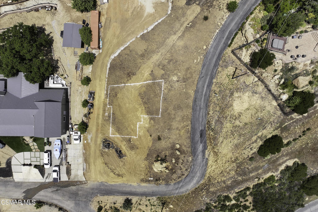 Perched at the top of a private road sits an approximately 20,000 square foot lot ready to build overlooking the San Fernando Valley. Property has been upgraded with a designed Septic system, and pits have been dug. Utilities are readily available, plans have been drawn and engineering included! Fantastic opportunity to build your new home with views you have to see to believe! Property is located within Ventura County Limits. in Simi Valley.