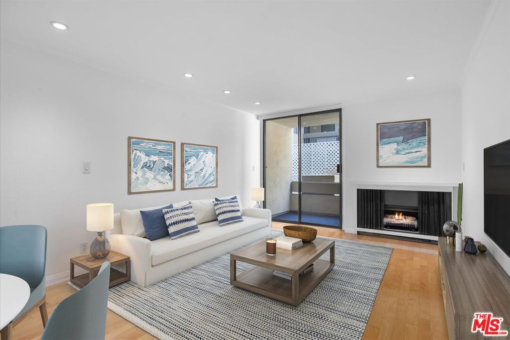 Welcome to Kings Villas, in the heart of chic West Hollywood. Live your best LA life in this bright and stylish condo, perfectly situated on one of the area's most walkable streets! Tucked between the vibrant energy of Santa Monica Blvd and the trendy vibes of Melrose Ave, you'll have Gelson's, Whole Foods, cozy cafes, and designer boutiques just a stroll away. This spacious, light-filled unit features natural hardwood floors, elegant marble tile, crown molding, and recessed lighting throughout. The kitchen boasts stainless steel appliances, marble countertops, and ample cabinet storage. The bedroom is accessed by a pocket door, and an oversized hallway closet offers ample storage, a generous patio spans the length of the entire unit. Modern perks? A new building access system with a touchscreen and phone notifications for guests. The Kings Villa complex is all about living in style: two bubbling spas, a billiards room, a fitness center, a package-secure mail area, and a rooftop deck with jaw-dropping 360 views of the city and hills. With your own underground parking spot, tons of guest parking, and EV/Tesla charging stations, you're set. Plus, laundry is conveniently located on the same floor, and low HOA fees cover water, trash, gas, and earthquake insurance. This place checks every box for West Hollywood living!