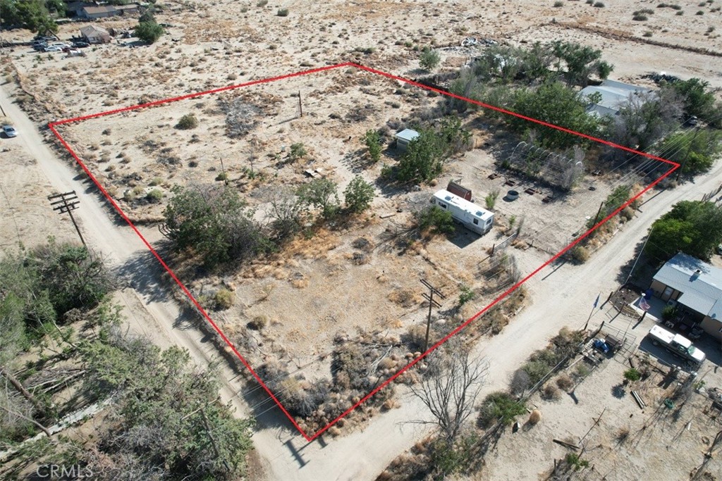 2-Acre Lancaster Retreat with Water, Solar Barn, RV & Approved Building Plans – Ready to Break Ground!
Discover the perfect blend of peace, practicality, and possibility with this 2-acre property in Lancaster, CA. This unique parcel is more than just land—it’s a ready-made foundation for your dream project. With a shared water well already in place, you’ll have reliable access to one of the most valuable resources in the desert. The property features a solar-powered barn, greenhouse for year-round growing, and an onsite RV—ideal for comfortable weekend escapes or as a base while you build. The best part? Building permits and professionally designed plans are already approved by the county, saving you time, money, and months of planning. Contact the co-listing agent for details on the building plans and to explore this ready-to-go