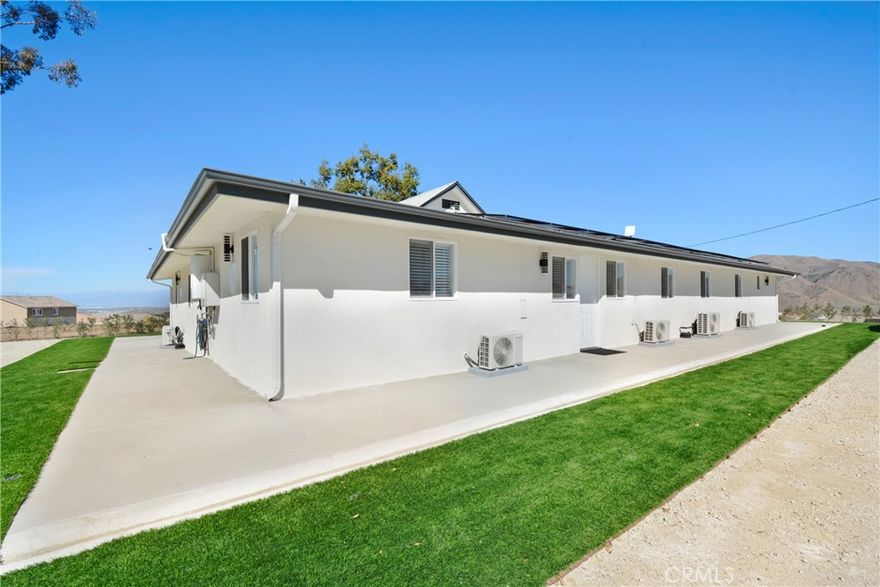 Modern and move-in ready , have you ever wanted to live close to the city but away from everyone? Private compound ! Located within Sycamore Hills in Corona, right off Indian truck trail and 15 freeway! 1 bedroom, 2 bathroom unit located in a well-maintained quadplex. This spacious studio features an open layout with laminate flooring throughout—no carpet! Enjoy a bright living space, brand-new appliances, and the convenience of an in-unit washer and dryer. The primary bedroom includes a small bathroom. The studio includes modern restrooms, a mini-split HVAC system, and stylish finishes add to the comfort of this home. You can also enjoy what the property has to offer, exterior built in BBQ area and a man made pond. The utilities are a flat $390 per month, covering water, Edison, Wi-Fi, and trash. Conveniently located near shopping, dining, and freeway access, this home offers modern living in a prime location. Schedule your viewing today! (two units available for rent for this quadplex call for more details, agent has a two bed 1 bath unit available as well). This is a large compound property and does not have any garage and the homes are on dirt/ gravel.