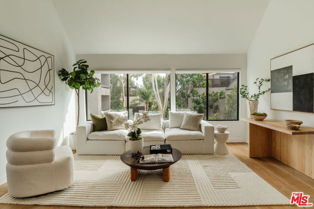 In the heart of West Hollywood, where creativity and energy pulse through every corner, a home awaits that feels like a sanctuary. Renovated in 2023, with a modern eye and a touch of warmth, this 1-bedroom, 1-bath + Loft residence invites you to live expansively, both indoors and out.Step inside, and light greets you instantly, pouring through the wall of windows, dancing across soaring vaulted ceilings, and settling around the gentle glow of the fireplace. The open living space feels like a gathering place, designed for late-night conversations, dinner parties that linger, and quiet evenings in. The chef's kitchen is crafted for both beauty and utility, Miele appliances, sleek quartz counters, and a thoughtful flow that makes hosting effortless, whether it's champagne brunch at the dining table or wine shared at the island bar. Retreat to the spacious bedroom, a calming hideaway with its own generous closet and a marble-accented bathroom that feels like a spa. Upstairs, the loft flexes to your life, a creative studio, a cozy guest nook, or the perfect home office. But the story doesn't end there. Ascend to your private rooftop, over 250 square feet of outdoor escape. Here, the Hollywood Hills become your backdrop. Sunrise coffees, sunset cocktails, laughter with friends under twinkling string lights. It's a stage for memories waiting to be made. Life at The Courtyards means more than just home; it means community. Swim laps, soak in the spa, unwind in the sauna, or break a sweat in the fitness center, all within a secure, gated environment. Two side-by-side parking spaces and extra storage ensure convenience matches style. And beyond your door? You're moments away from Gelson's, local parks, and the restaurants, cafs, and nightlife that make West Hollywood one of Los Angeles' most magnetic neighborhoods.